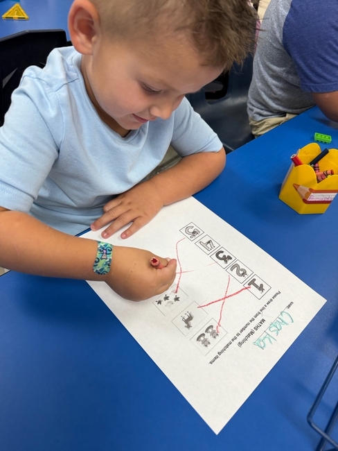 Preschooler working on Counting activity at Grow and Learn Preschool
