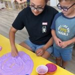 Rylan and Ms Debany helping make slime