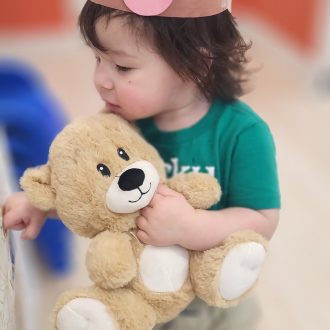 Toddler with Teddy Bear at our preschool and daycare